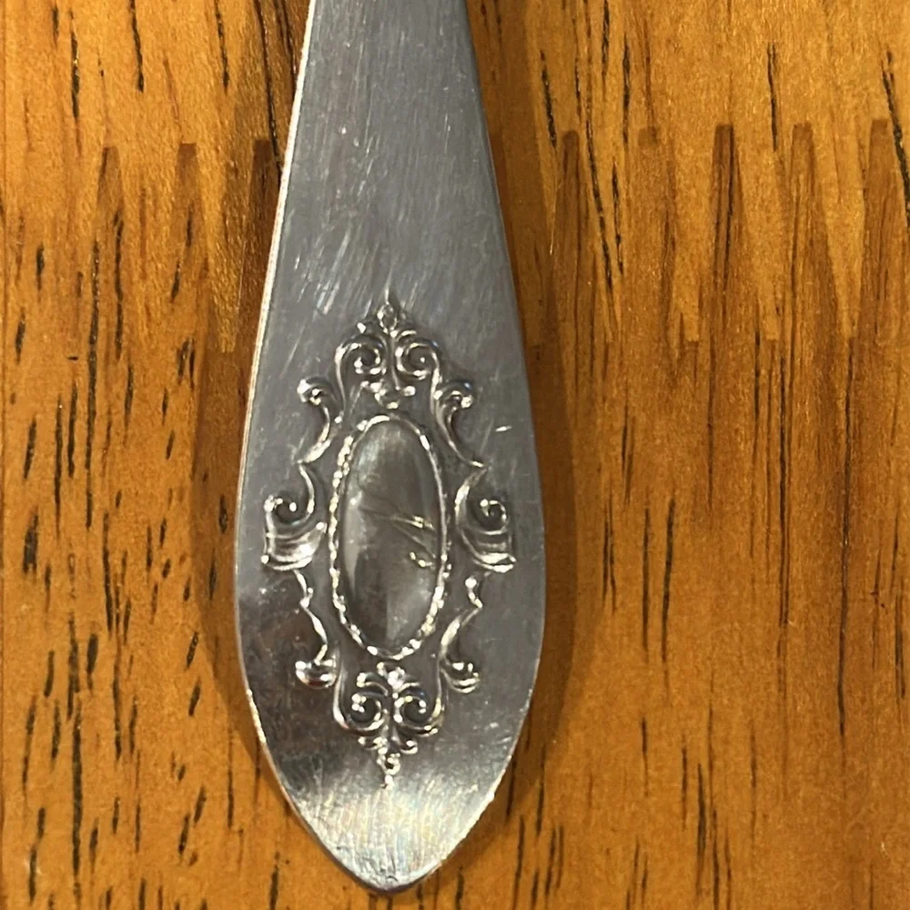 CV silver fork and spreading knife with the same pattern. Early 1900’s